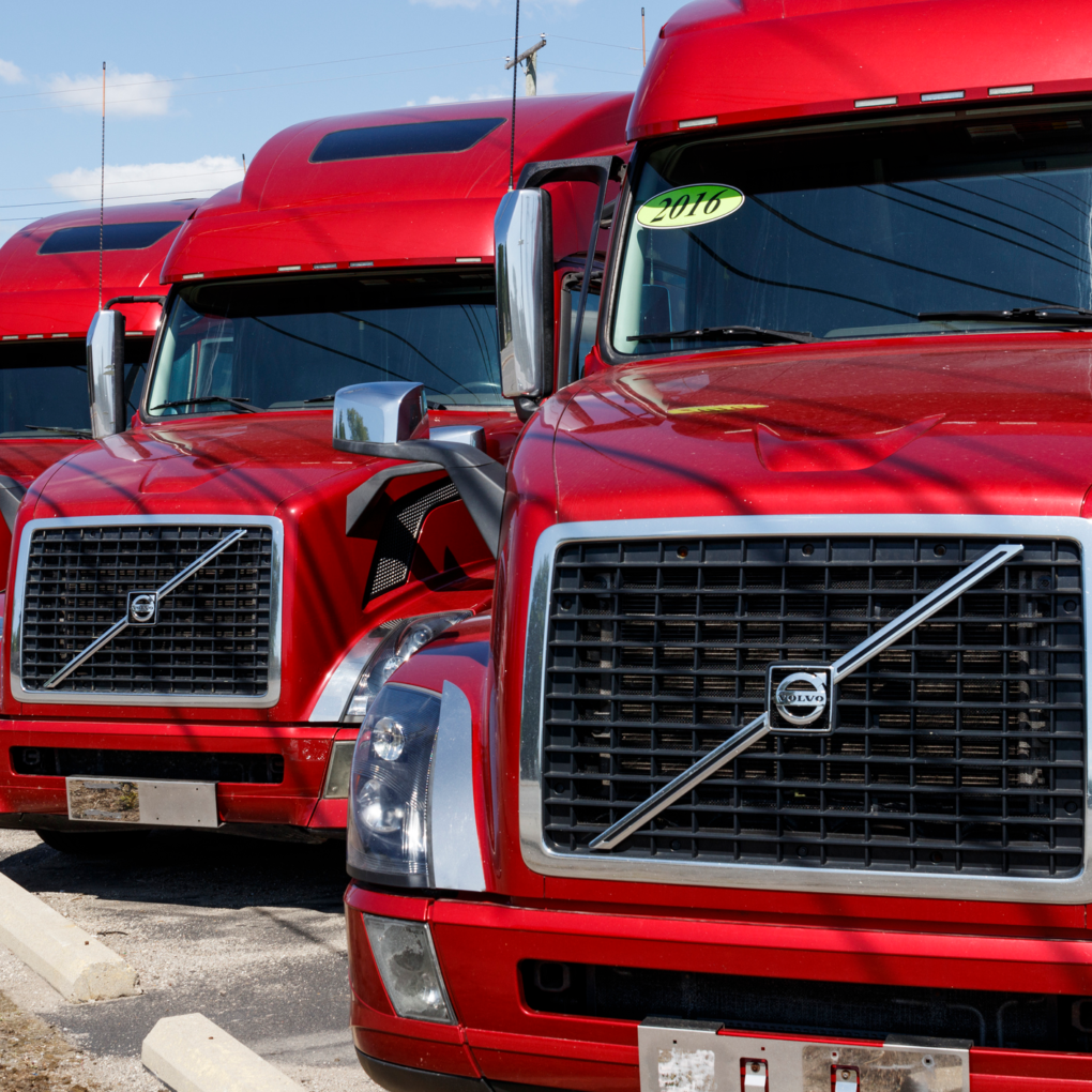 Volvo Semi Tractor Trailer Trucks Lined up for Sale. Volvo is one of the largest truck manufacturers VI